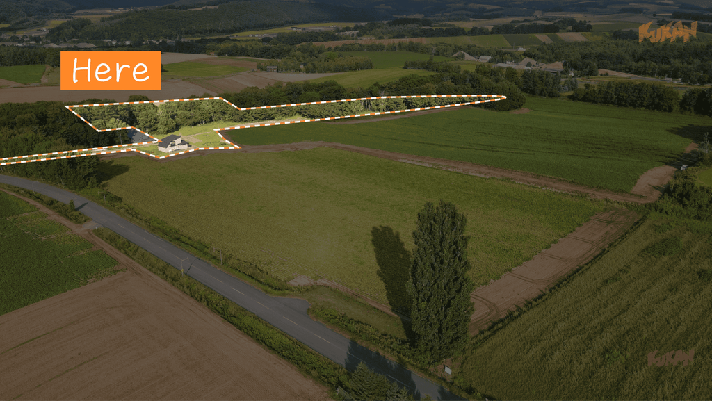 Panoramic aerial view showing the site area of resort development land near Biei's Ken & Mary Tree in Hokkaido