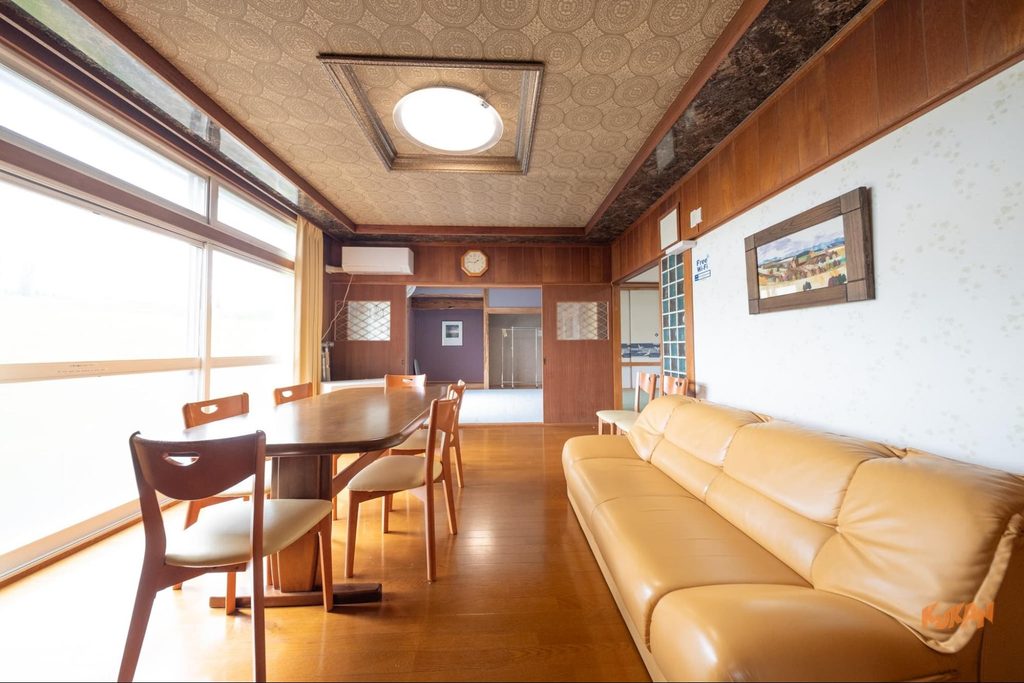 Living and dining area interior of the building on resort development land near Biei's Ken & Mary Tree in Hokkaido
