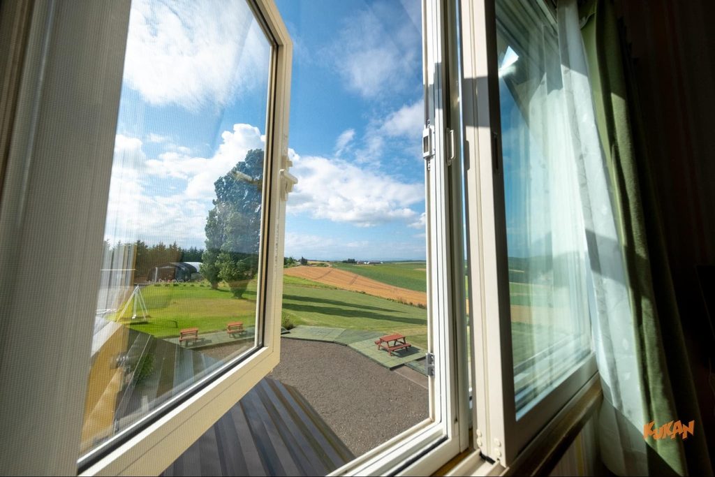 View of Biei's Ken & Mary Tree from the window of the building on resort development land in Hokkaido
