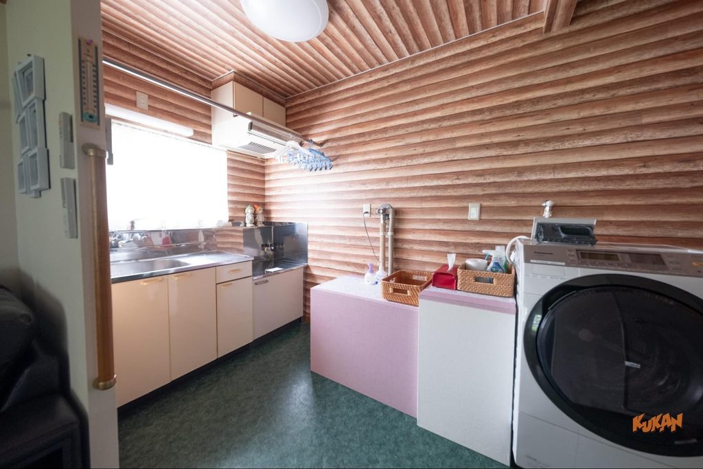 Kitchen and laundry area of the building on resort development land near Biei's Ken & Mary Tree in Hokkaido